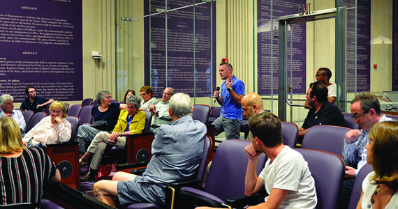 Audience member asking a question at a Wednesdays at the Kline event.